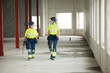 © Johnér - Female engineers discussing while walking at construction site
