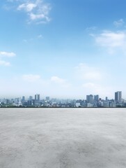 A city skyline with a clear blue sky. The sky is dotted with clouds, and the city is visible in the distance. Scene is peaceful and serene, with the cityscape providing a sense of calmness