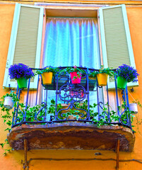 Wall Mural - flowered balcony in the historic center of Acqui Terme Italy	