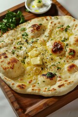 Wall Mural - A pizza with cheese and parsley on top sits on a wooden tray. The pizza is golden brown and has a crispy crust. The parsley adds a pop of color and freshness to the dish