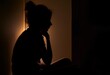 © larich - Silhouette Of One Depressed Young Woman Sitting At Home In The Dark Lonely Girl Suffering Alone From Mental Illness, Generative AI