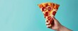 © Pungu x - Hand holding a slice of pepperoni pizza against a pastel blue background in a minimalist advertisement with studio lighting