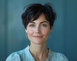 © hakule - A woman with short hair and a green shirt is smiling