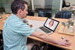 © Oscar - businessman in a business meeting via video call. doctor attending to her patient via conference call.