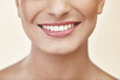 © peopleimages.com - Woman, lips and teeth in studio for beauty with makeup, cosmetics and glow with pride for cosmetology or self care. Girl, zoom and isolated with happiness for natural shine and aesthetic for mouth.