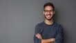 © LU - Portrait of young handsome smiling business guy wearing gray shirt and glasses, feeling confident with crossed arms, isolated on white background