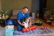 © Leonardo Borges Nuñez/Stocksy - Positive male physiatrist helping little disabled girl at home