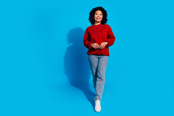 Wall Mural - Full length photo of lovely young lady posing model shopping dressed stylish red garment isolated on blue color background