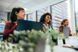 © VICTOR TORRES/Stocksy - Diverse team smiling and working in modern office