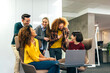 © VICTOR TORRES/Stocksy - Collaborative team having a casual meeting in office space