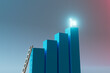 © Giada Canu/Stocksy - Goal Achievement Bar Graph with Illuminated Flag