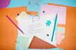 © Colour Laboratory/Stocksy - Colourful office supply and speech bubble paper clip saying attention