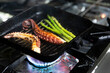 © Tim Booth/Stocksy - Cooking octopus and asparagus