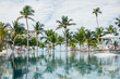 © VICTOR TORRES/Stocksy - Serene tropical resort oasis with infinity pool