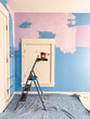 © Raymond Forbes LLC/Stocksy - Paintbrush and pail home improvement renovation bedroom in house