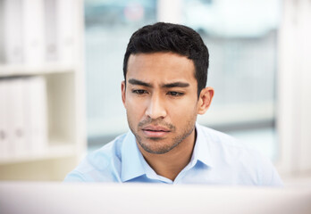 Poster - Business man, computer and serious in office with reading, research and planning for website. Internet, technology and email with online project and digital content design at startup with web writing