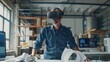 © Thirawat - In the heart of a bustling design studio, a Caucasian architect uses VR headsets to perfect a new building project