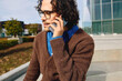 © Edward Córdoba / Andréas Sichel/Stocksy - Young professional man speaking on the phone