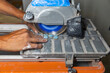 © Raymond Forbes LLC/Stocksy - Tile cutting Construction Home Improvement renovation job