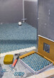 © Raymond Forbes LLC/Stocksy - Residential Home Improvement renovation sponge in bathroom