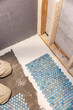 © Raymond Forbes LLC/Stocksy - Tile floor Construction  Residential Home Improvement  renovation