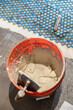 © Raymond Forbes LLC/Stocksy - Tile Construction in Residential Home Improvement renovation grout