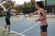 © Jordana Sheara/Stocksy - friends outside during a game of pickleball