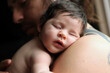 © Dina Marie Giangregorio/Stocksy - Close Up Of Baby Sleeping on Parents Shoulder