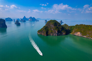 Wall Mural - Aerial view Tourist speed boat in national park Phang Nga bay and Hong island with jungle, trip in Thailand. Concept nature beautiful landscape of Asia travel