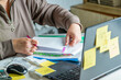 © Olena Smyrnova/Stocksy - Anonymous hands of an accountant working with documents