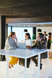 © BONNINSTUDIO/Stocksy - Financial advisors working on project in office