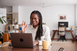 © Malquerida Studio/Stocksy - Positive woman greeting in Video Call