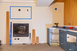 © Raymond Forbes LLC/Stocksy - House Construction with gas fireplace and living room