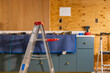 © Raymond Forbes LLC/Stocksy - House improvement project kitchen construction with ladder