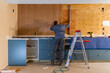 © Raymond Forbes LLC/Stocksy - Home Construction worker using level tool