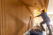© Raymond Forbes LLC/Stocksy - Carpenter building Vertical wood paneling wall