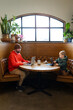 © Bethany Birnie/Stocksy - Family lunch date