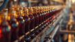 © mila103 - A row of bottles of soda are being made in a factory