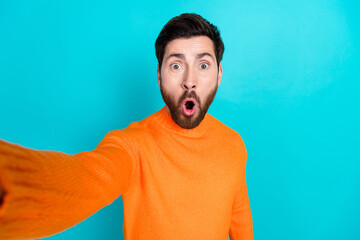 Sticker - Photo of shocked nice young man wear orange trendy clothes make selfie isolated on cyan color background