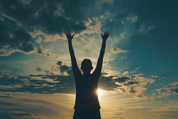 Wall Mural - silhouette of person with hands raised to sky spiritual connection and hope concept