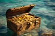 © anatolir - Open wooden treasure chest filled with gold coins floating in the clear blue sea