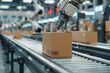 © aiqing - Robot arm sorting cardboard boxes on steel conveyor in warehouse.