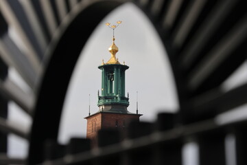 Wall Mural - Artistic photo of Stockholm City Hall's tower. With an Swedish symbol.The three golden crowns on top