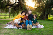 © Kelsey - Lifestyle Family Portrait of Young Family Smiling Together at Sunset