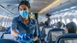 © spyrakot - Health Safety Measures by Airline Staff Providing Masks and Sanitizer to Passengers on Airplane