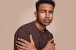© nomad studio/Stocksy - Young man with inquisitive expression