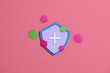 © Marc Tran/Stocksy - Virus protection banner with shield on pink background