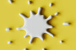 © Giada Canu/Stocksy - stylized White Splash on Yellow Background