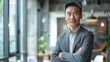 © Bijac - confident mature asian businessman standing in modern office executive portrait