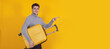 © carballo - isolated young man or student with suitcase pointing
